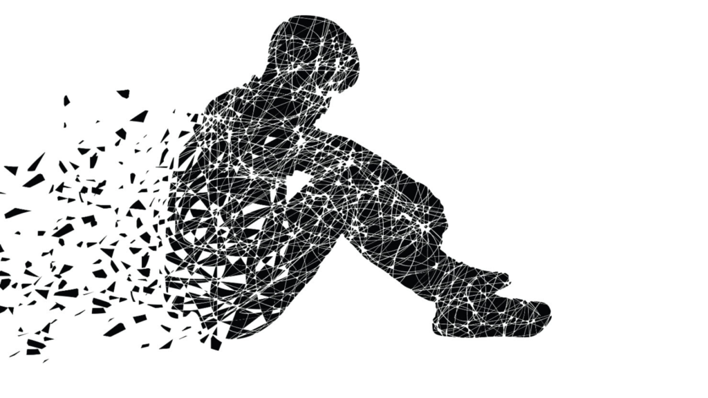 Person der sidder alene og ser nedtrykt ud, som symbol på depression og lav energi